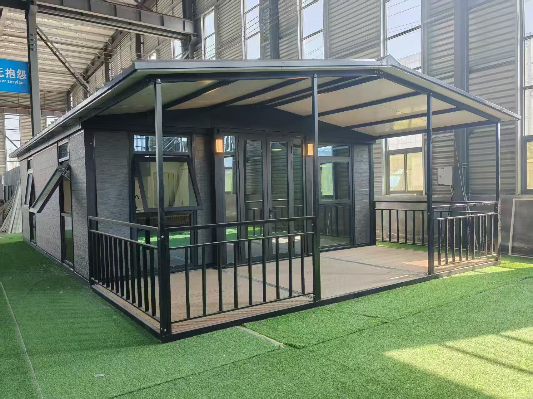 Expandable container house with porch and large windows for temporary accommodation and modular living projects.