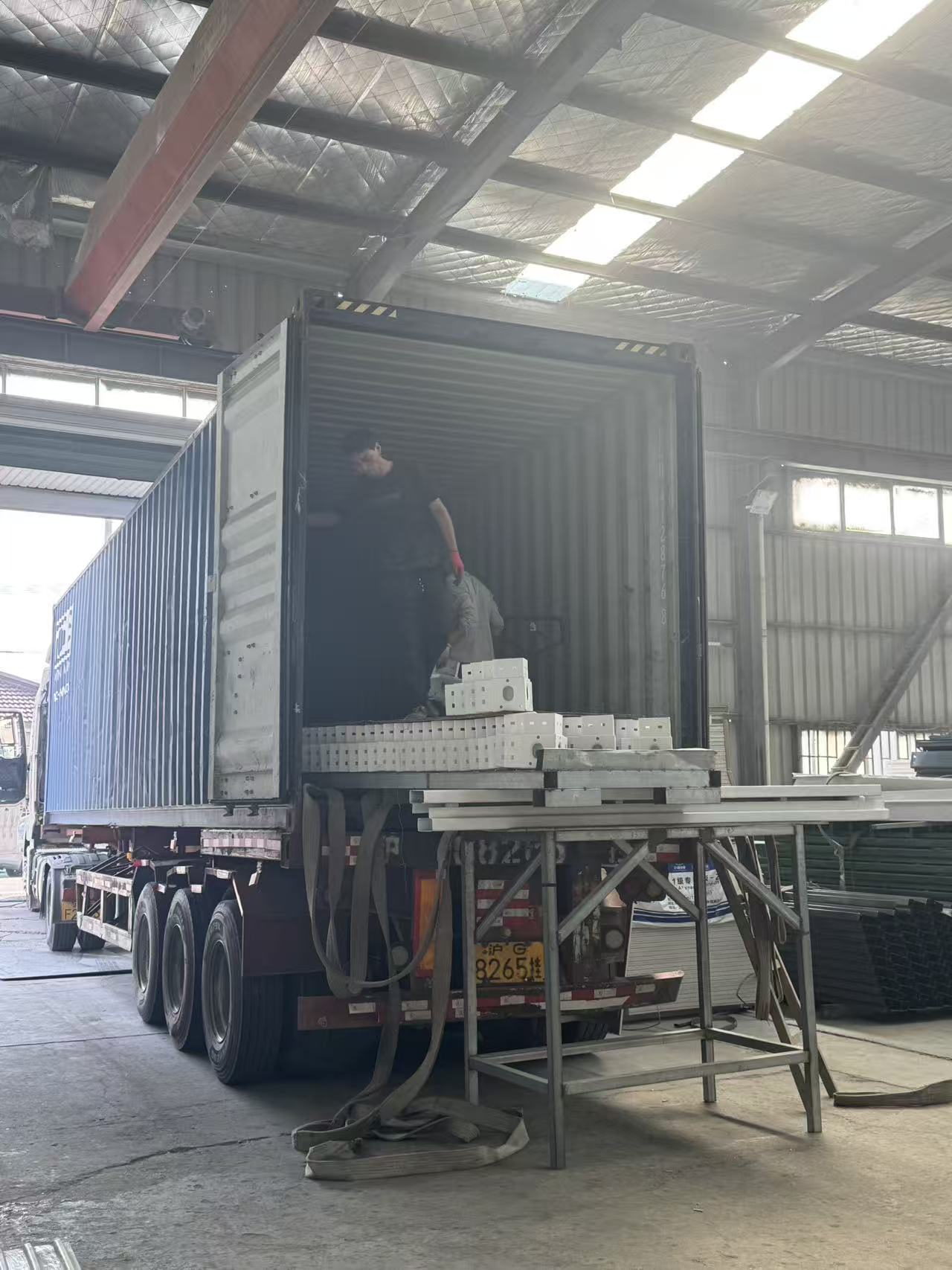 Hongtai container house steel frame components loaded into a shipping container for export