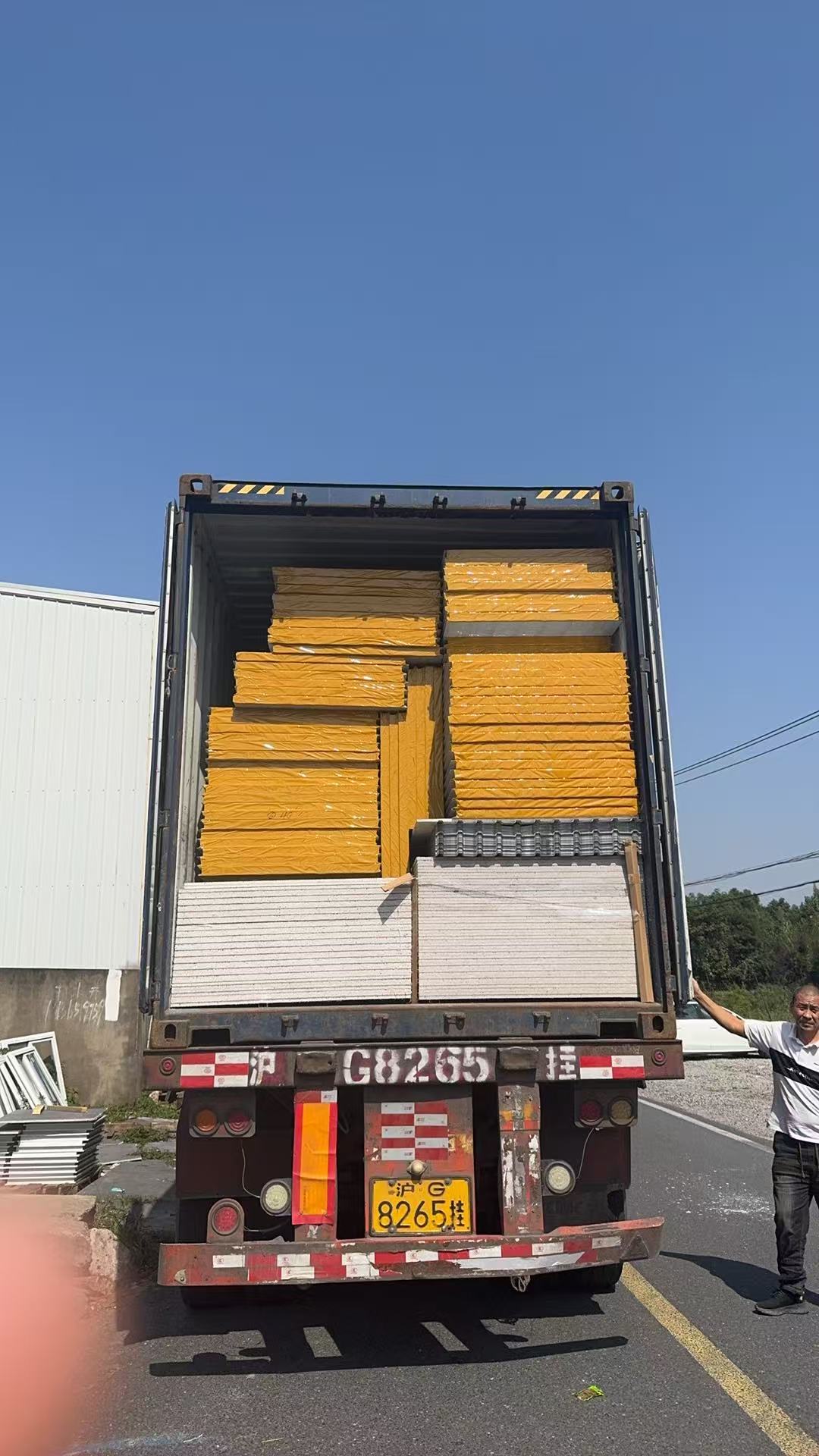 Hongtai insulated sandwich wall panels loaded inside a shipping container for export