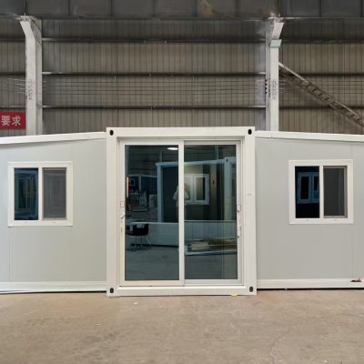 Front view of an expandable container house with glass door and windows