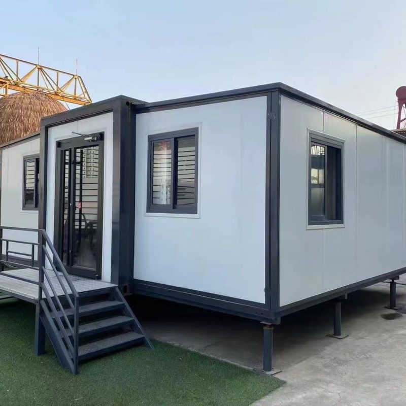 Exterior view of an expandable container house with entrance steps