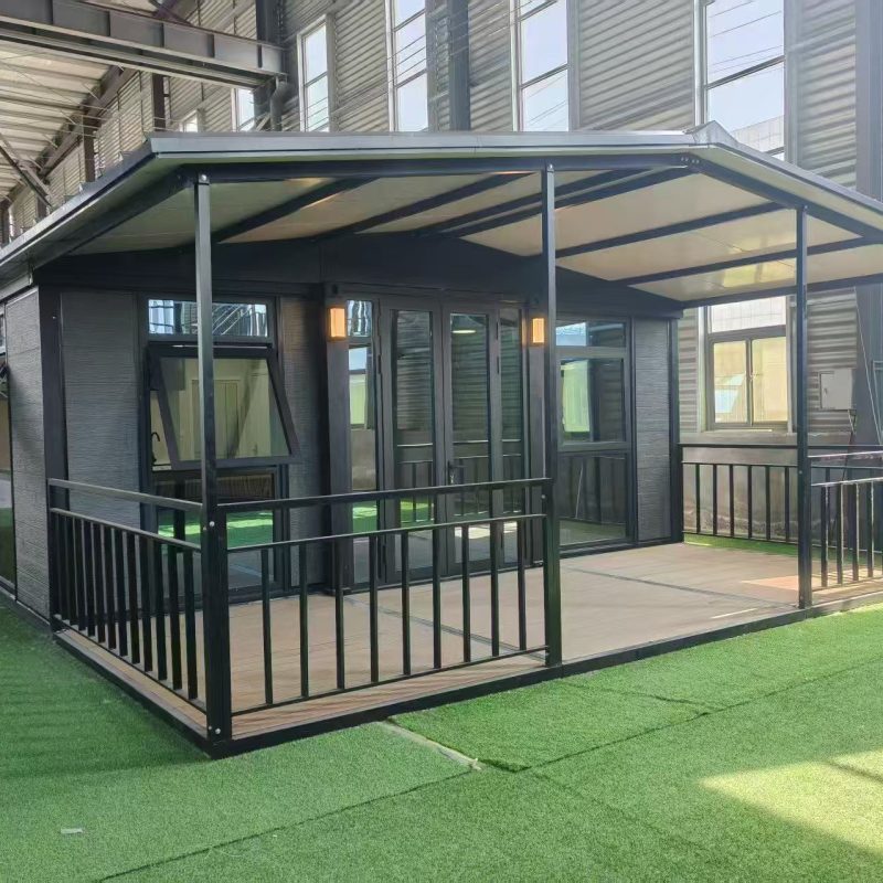Expandable container house with porch and large windows for temporary accommodation and modular living projects.