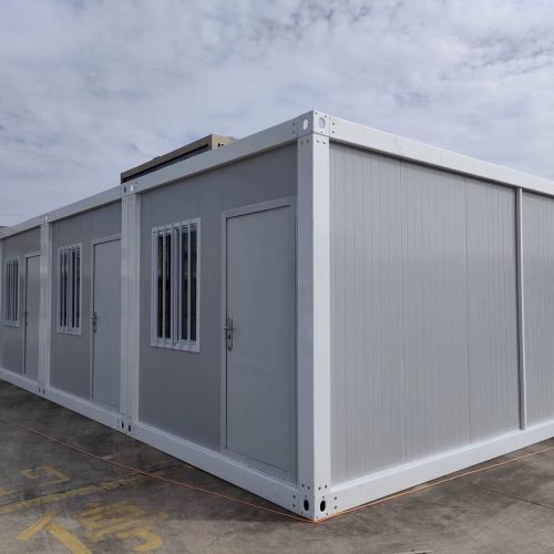 Single-story flat pack container house exterior with modular steel structure and insulated wall panels