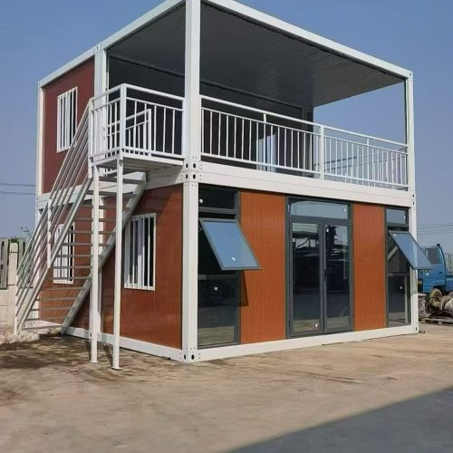 Two-story modular site office building with external stairs, rooftop terrace, and glass doors